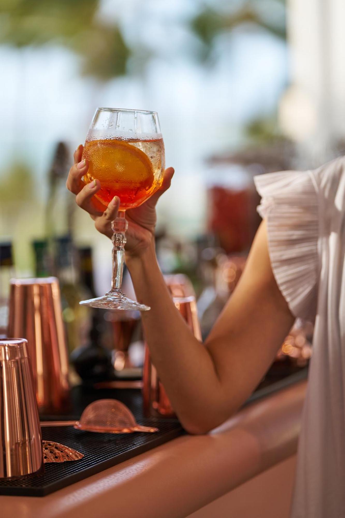 Lux* Belle Mare Resort & Villas Экстерьер фото A glass of Aperol Spritz