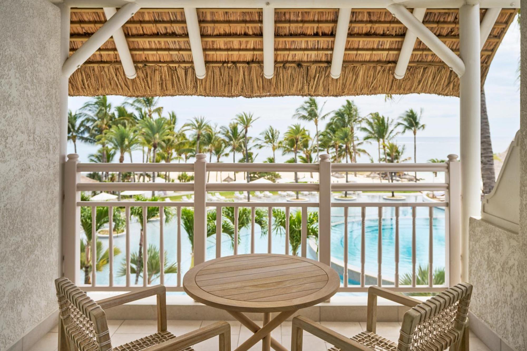 Lux* Belle Mare Resort & Villas Экстерьер фото Balcony of a guest room